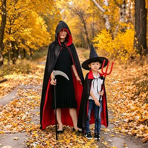 Halloween reversible red and black cloak for adults and kids in autumn forest setting