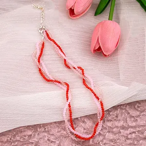 Detailed macro view of triple-layered faceted glass bead necklace with adjustable clasp