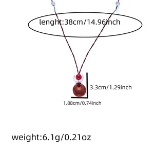 Detail showing dimensions of red agate pendant necklace with crescent moon accent