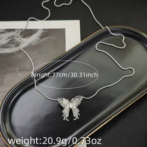 Detail of silver butterfly pendant necklace showing 77cm length and 20.9g weight dimensions