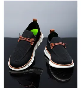 Detail of breathable mesh upper and durable cushioned white sole on casual men shoes