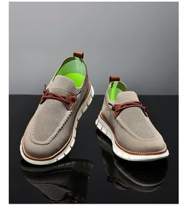 Detailed view of breathable khaki mesh upper and thick white cushioned sole of men shoes