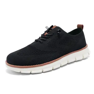 Men's breathable knit loafers in black with brown leather accents and thick white soles