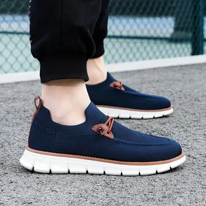 Men's breathable navy knit slip-on sneakers with white shock-absorbing soles for casual wear