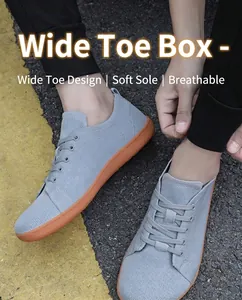 Close-up of gray breathable knit barefoot shoes with wide toe box and flexible gum sole