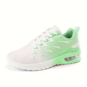 Breathable mesh running shoes in white and mint green with visible air cushion