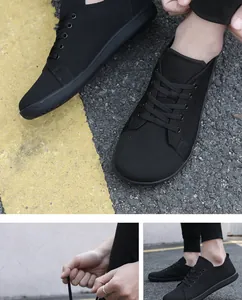 Detailed views of breathable mesh barefoot sneakers on asphalt road with lace-up focus