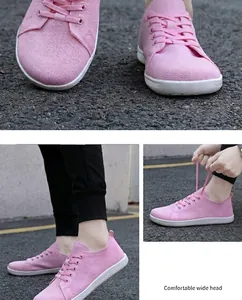 Close-up of pink breathable knit barefoot shoes with a comfortable wide-toe design