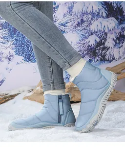 Detail view of light blue waterproof snow boot with warm plush lining and side zipper