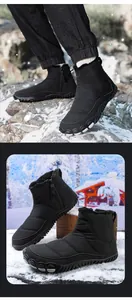 Detail view of black waterproof snow boot with warm fur lining and side zipper