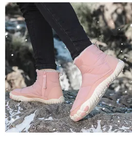 Detailed side view of pink waterproof winter snow boots with side zipper and plush lining