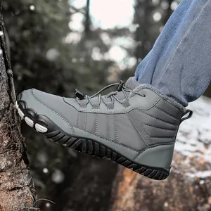 Close-up of gray high-top winter snow boots with warm plush lining and non-slip rubber soles