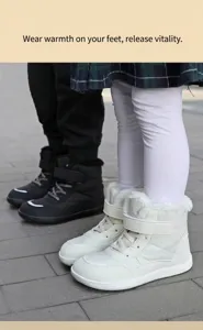 Close-up of children's high-top winter snow boots with warm faux fur lining and velcro strap
