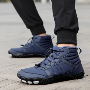 Detail view of deep blue winter snow boot with thick gray fleece lining and drawstring