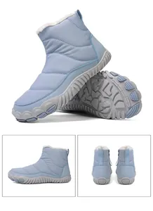 Detail view of light blue waterproof snow boots with fleece lining and anti-slip soles
