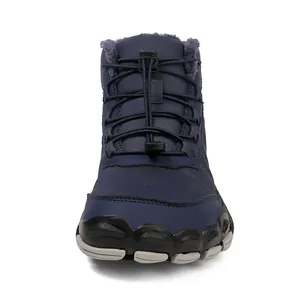 Detail view of waterproof navy winter boots with thick purple faux fur lining and bungee laces