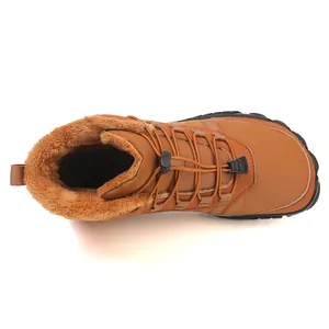 Detail view of winter hiking boot with warm brown faux fur lining and bungee laces