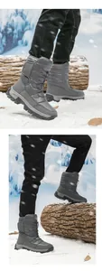 Detail of high-top winter snow boots with waterproof grey fabric and anti-slip rubber sole