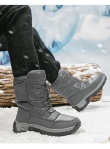 Detail of grey winter snow boots with drawstring laces and thick anti-slip rubber outsoles