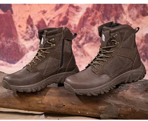Brown tactical boot with side zipper and rugged outsole on natural wood background