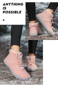 Detail of pink winter snow boot showing warm faux fleece lining and toggle lacing system