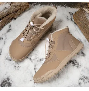 Detail of khaki outdoor snow boots featuring thick faux fleece lining and durable rubber soles