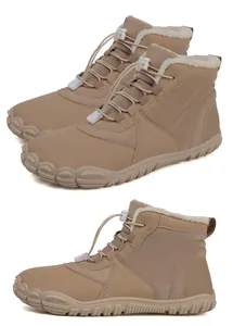 Detail of light brown barefoot snow boots with fleece lining and drawstring system