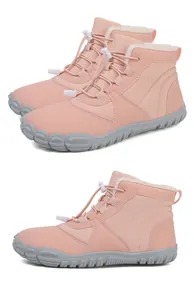 Detail of pink winter snow boots with thick faux fur lining and non-slip rubber soles