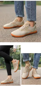 Detail view of khaki barefoot shoe with breathable mesh and durable orange rubber sole
