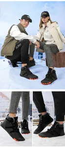 Close-up of waterproof winter snow boots with warm faux fur lining and orange toe guard