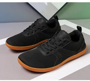 Detailed close-up of anti-slip barefoot sneakers featuring mesh fabric and orange rubber sole