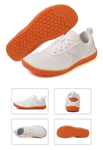 Multiple views of white barefoot sneakers with orange anti-slip rubber soles and mesh fabric