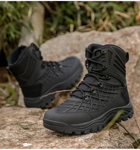 Macro view of black high-top tactical boot on rocks with heavy-duty rubber sole texture