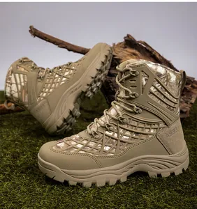 Detailed view of tactical boots with thick rubber soles on a natural grass background