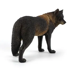Realistic grey wolf figurine with detailed fur texture standing on white background