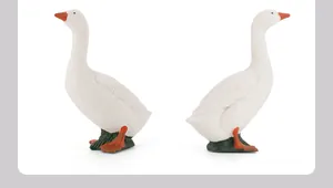 Detailed pair of realistic white goose animal figurines with orange beaks and webbed feet
