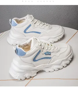 Detailed side view of winter platform sneakers with warm plush lining and blue accents