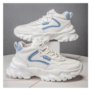 Detail of white leather platform sneaker with light blue accents and non-slip sole