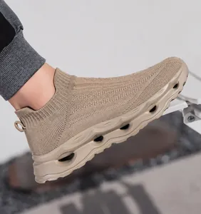 Close-up of khaki breathable knit upper and wavy textured thick sole on slip-on sneaker