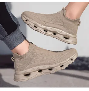 Detail of khaki breathable knitted mesh sneaker featuring a hollow wave cushioning sole