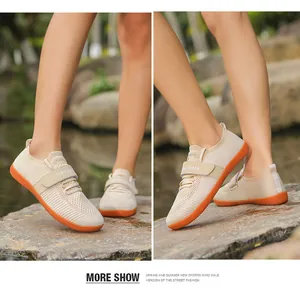 Detail view of beige mesh training shoes with breathable fabric and velcro straps