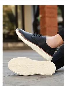 Detail of casual leather oxfords with thick non-slip soles and wave traction pattern
