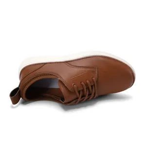 Top view of brown casual oxford shoes with white thick soles and decorative stitching