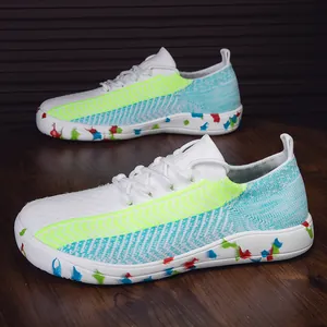 Scarpe sportive in maglia da donna con accenti verde neon e suola con spruzzi di colore