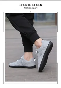 On-foot view of gray breathable barefoot running shoes with flexible rubber soles