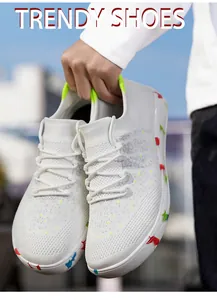 Detail showing white breathable mesh upper and colorful star graffiti on the midsole