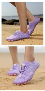 Macro detail of breathable purple mesh and pink non-slip sole on quick-dry water shoes
