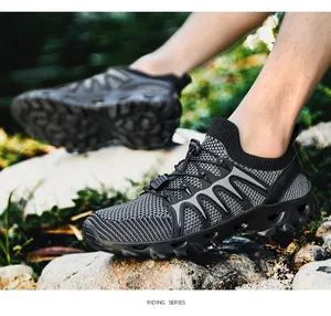 Close-up of breathable knit fabric and quick-lace system on black hiking shoes