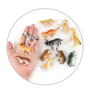 Miniature wild animal figurine set shown next to a hand to illustrate small scale size