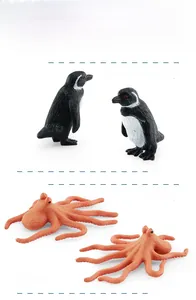 Detailed plastic educational models of Galapagos penguin and octopus with clear textures